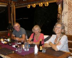 Rob, Barb, and Marina dining at Viani Bay resort